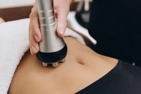 Technician performing non-surgical body contouring treatment