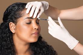 Botox injection being administered to forehead lines