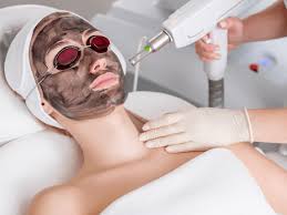 Laser hair reduction on woman's legs in clinic